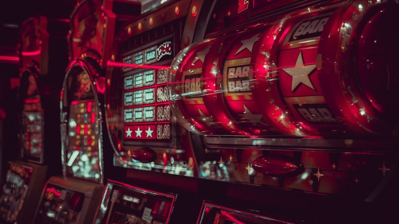 Glowing cryptocurrency symbols floating above a dark digital casino interface with blockchain network lines
