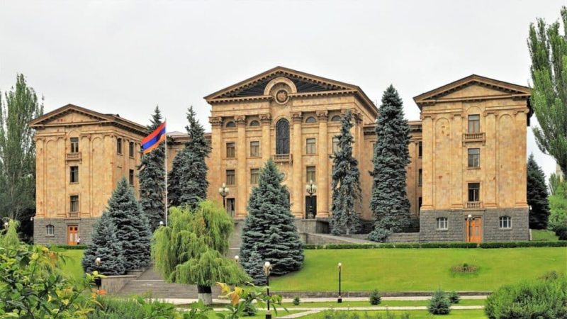 Digital map of Armenia overlaid with glowing online casino interface elements on a dark background