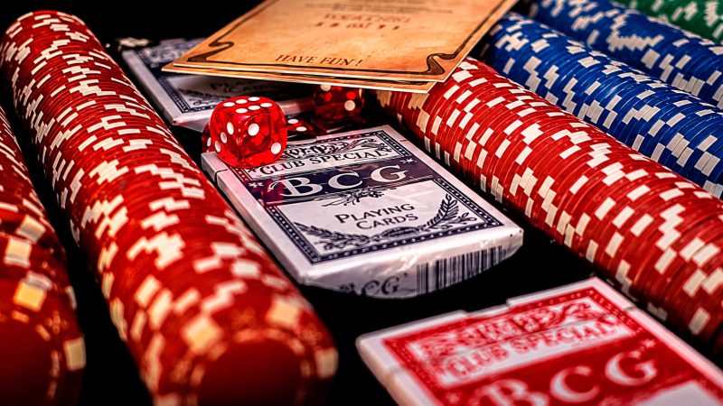 Smartphone displaying live casino interface with glowing multiplier graphics on dark background