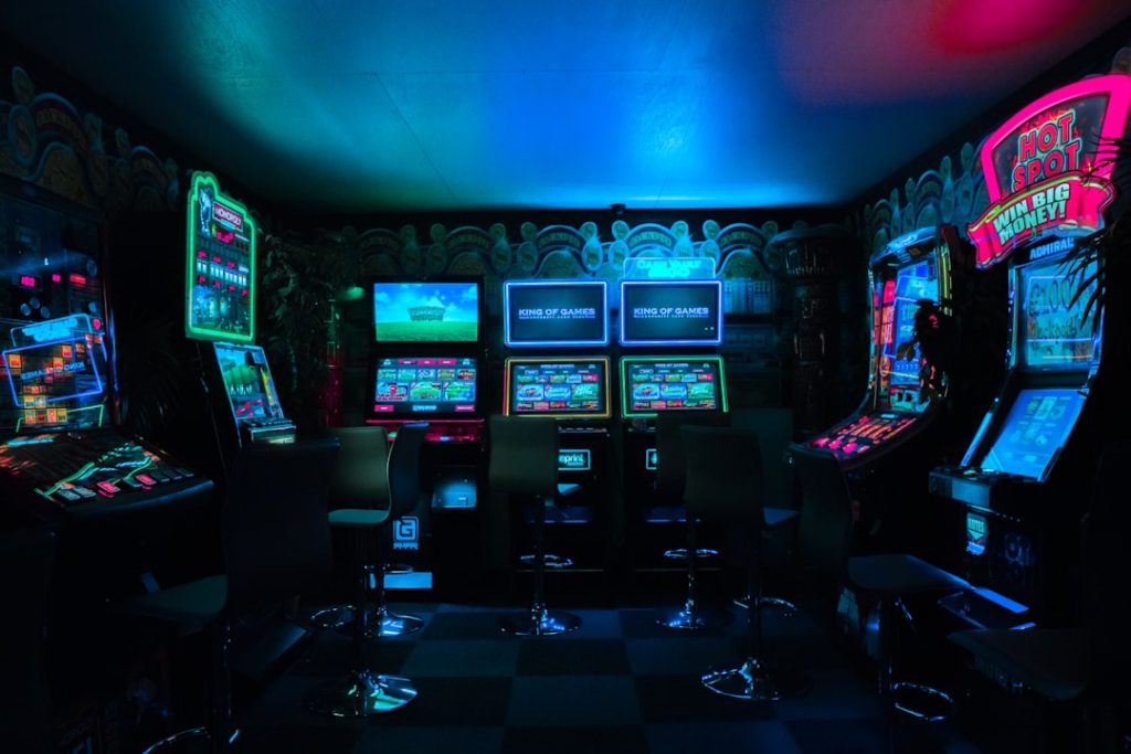 Dramatic courtroom gavel striking beside a glowing digital crash game multiplier graph on a dark background
