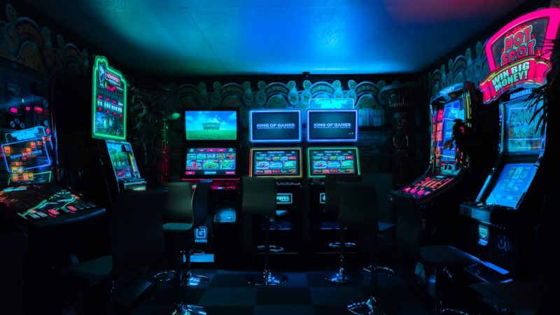 Dramatic courtroom gavel striking beside a glowing digital crash game multiplier graph on a dark background