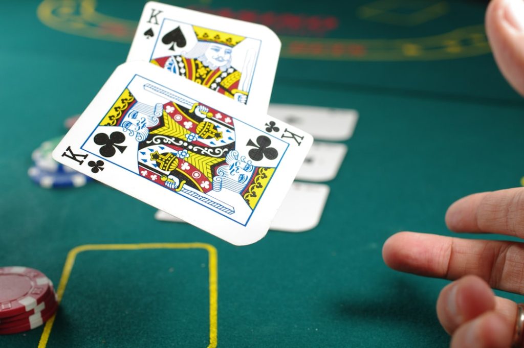 Dramatic courtroom gavel striking block with digital casino game interface glowing in background